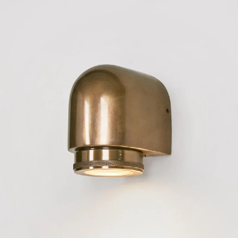 art deco wall lamps with geometric patterns for a retro - inspired bathroomSea Rock Outdoor Wall Light Antique Brass